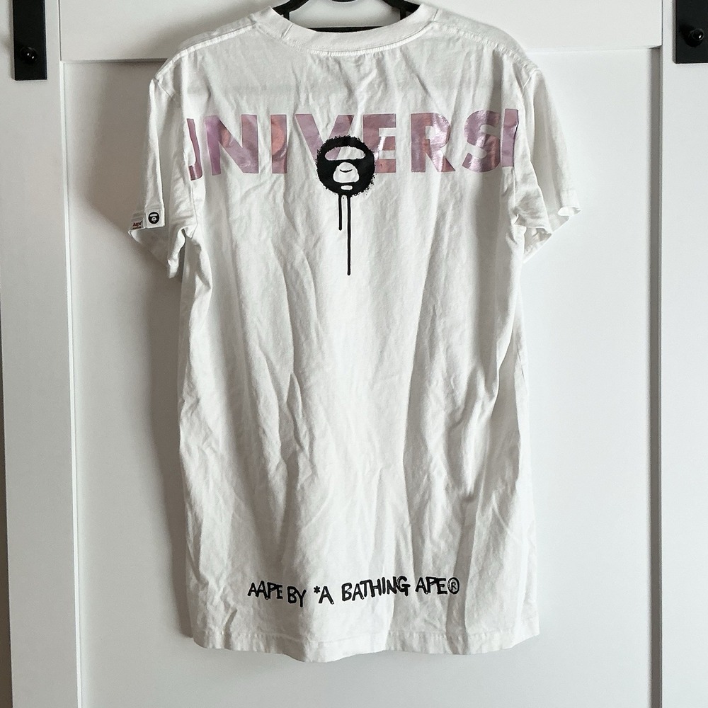 A Bathing APE White Short Sleeve Graphic Tee with Pink Accents